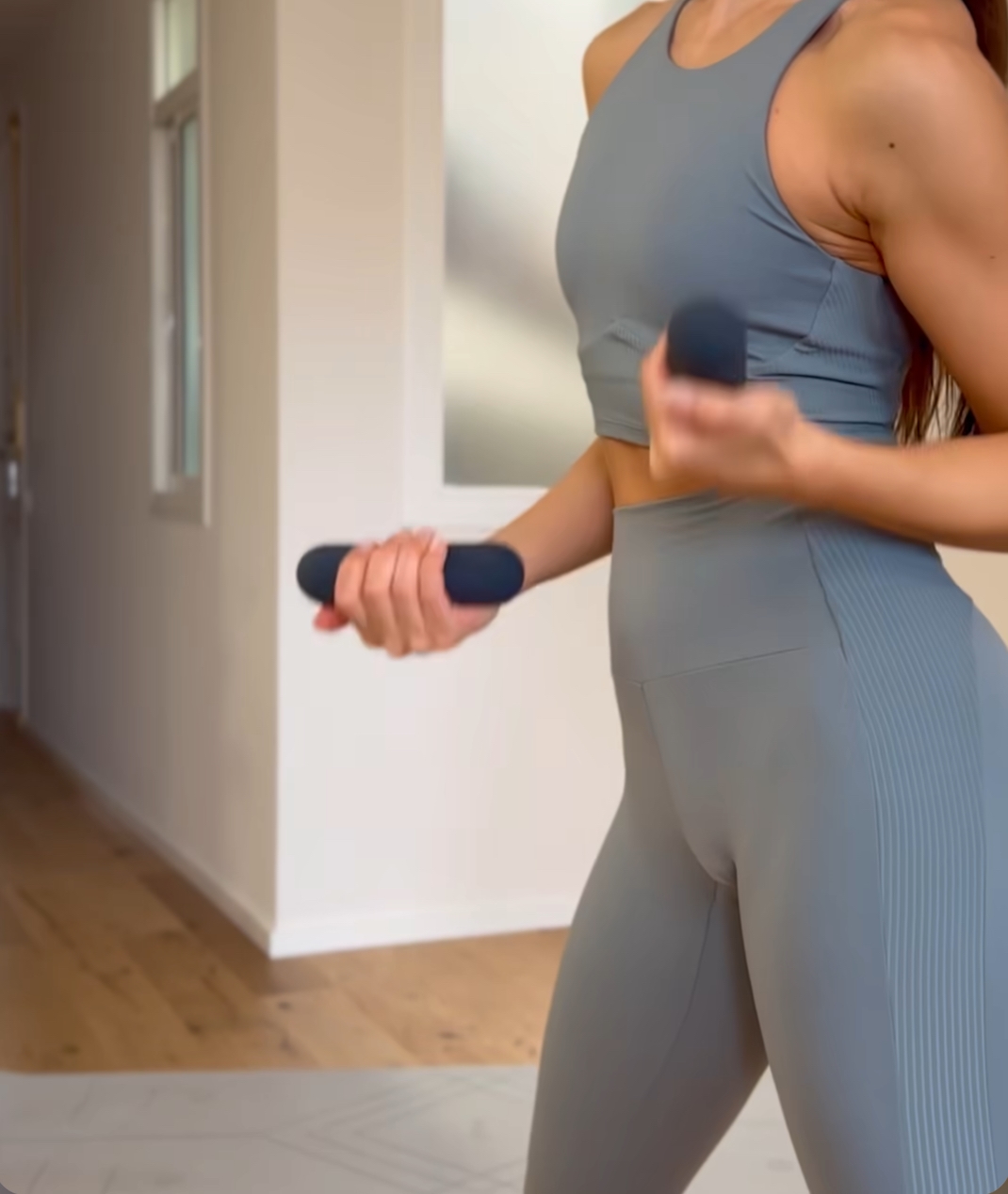 Pilates workout with hand weights